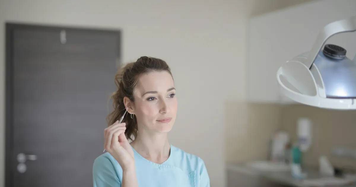 A patient at a primary care wellness visit in a Southern California exam room