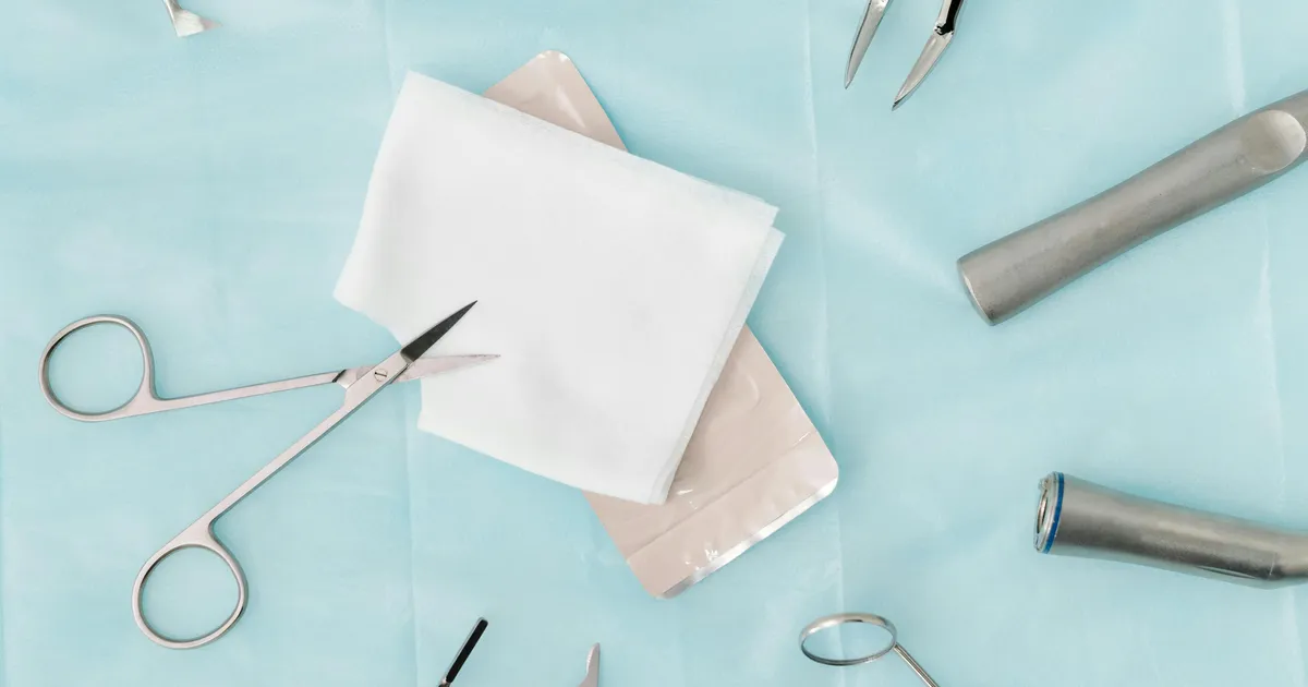 Orthopedic surgical instruments on a tray, representing orthopedic medical billing